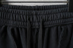 Black pants waistband with gathered elastic and structured band top