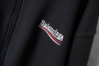 Balenciaga hoodie logo close-up with red-and-white stripe lettering