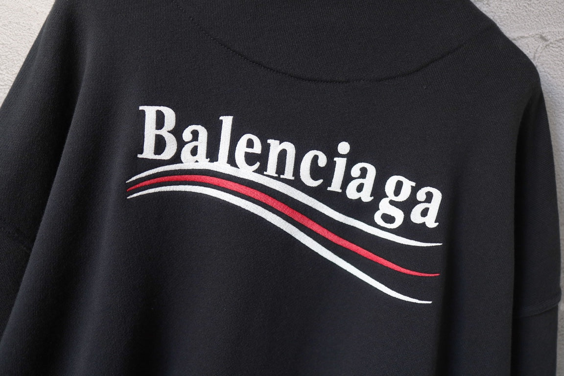 Balenciaga hoodie back logo close-up with red-and-white curved stripe lettering