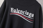 Zip-up jacket back logo detail with Balenciaga lettering and red stripe, dark fabric.