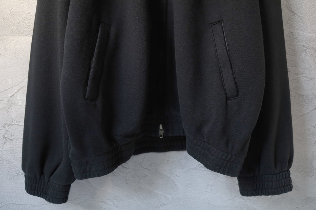 Balenciaga black zip-up hoodie back view with ribbed hem and cuffed sleeves
