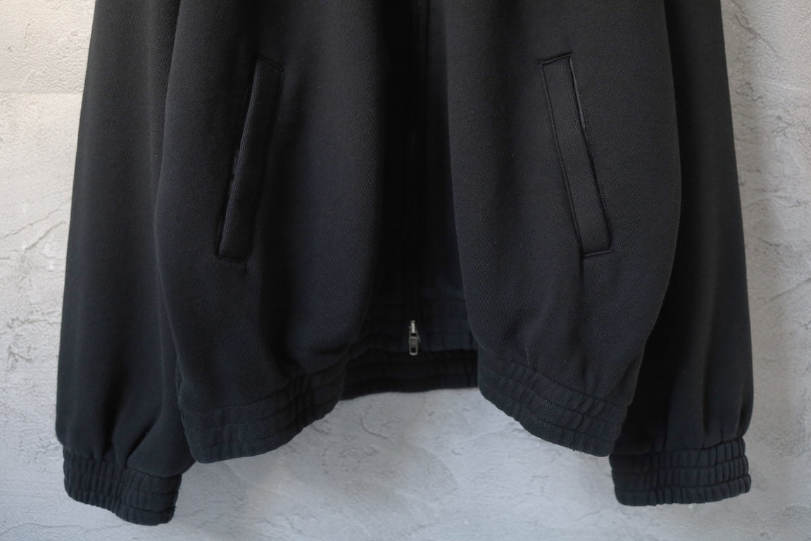 Balenciaga black zip-up hoodie back view with ribbed hem and cuffed sleeves