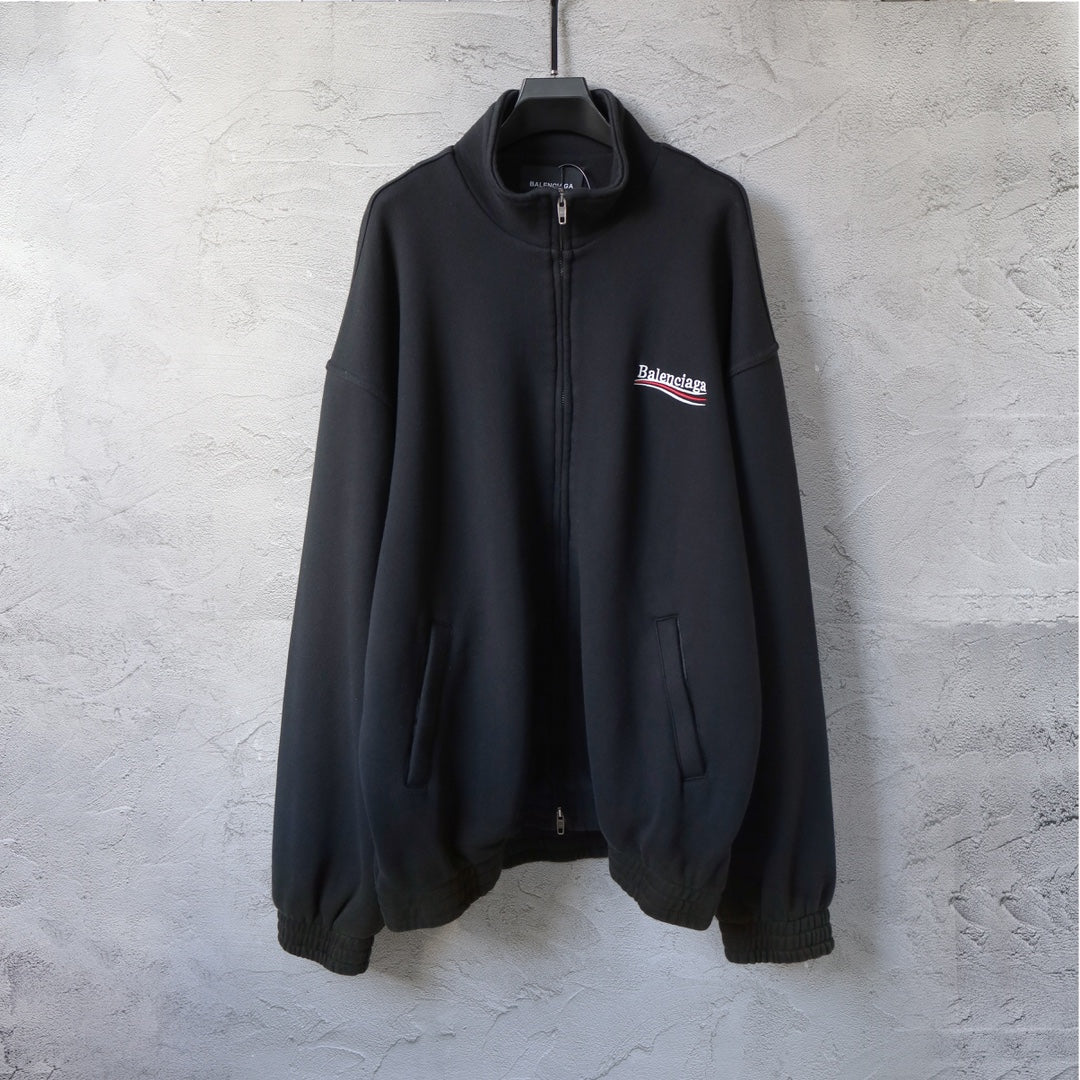Balenciaga black zip-up hoodie with front zipper, chest logo, and drawstring pockets