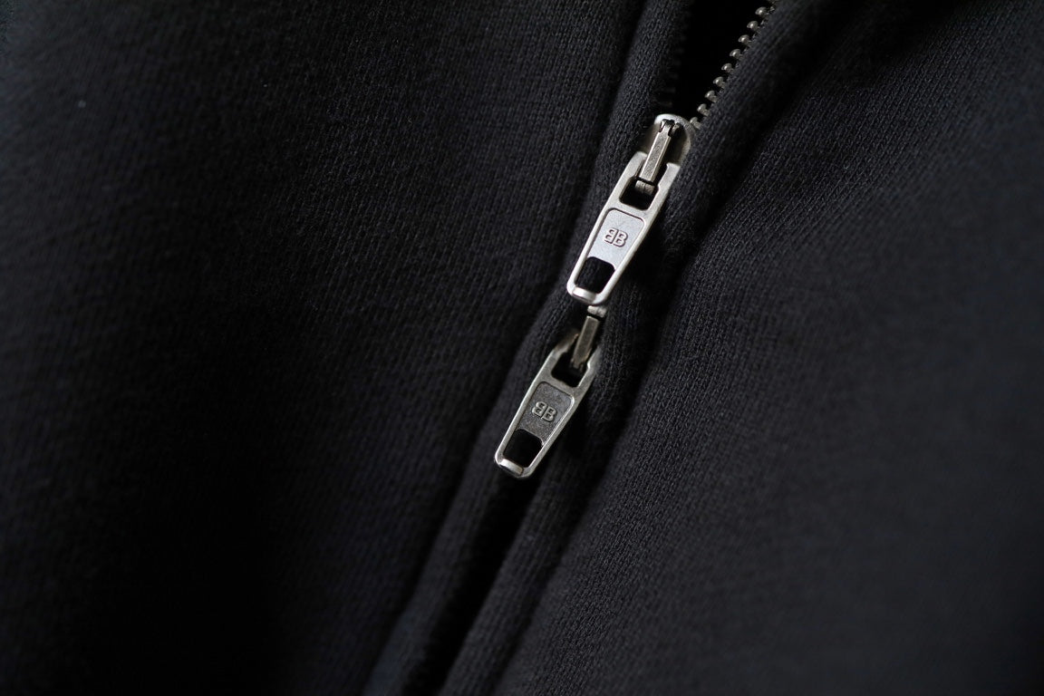 Balenciaga zip-up hoodie close-up of metal zipper pull and slider