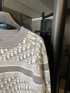 Light gray Dior monogram knit sweater with crew neckline and wide gray stripe