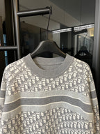 Light gray Dior monogram knit sweater with ribbed crew neckline and striped band