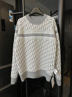 Light gray knit sweater with allover Dior monogram and wide horizontal gray stripe
