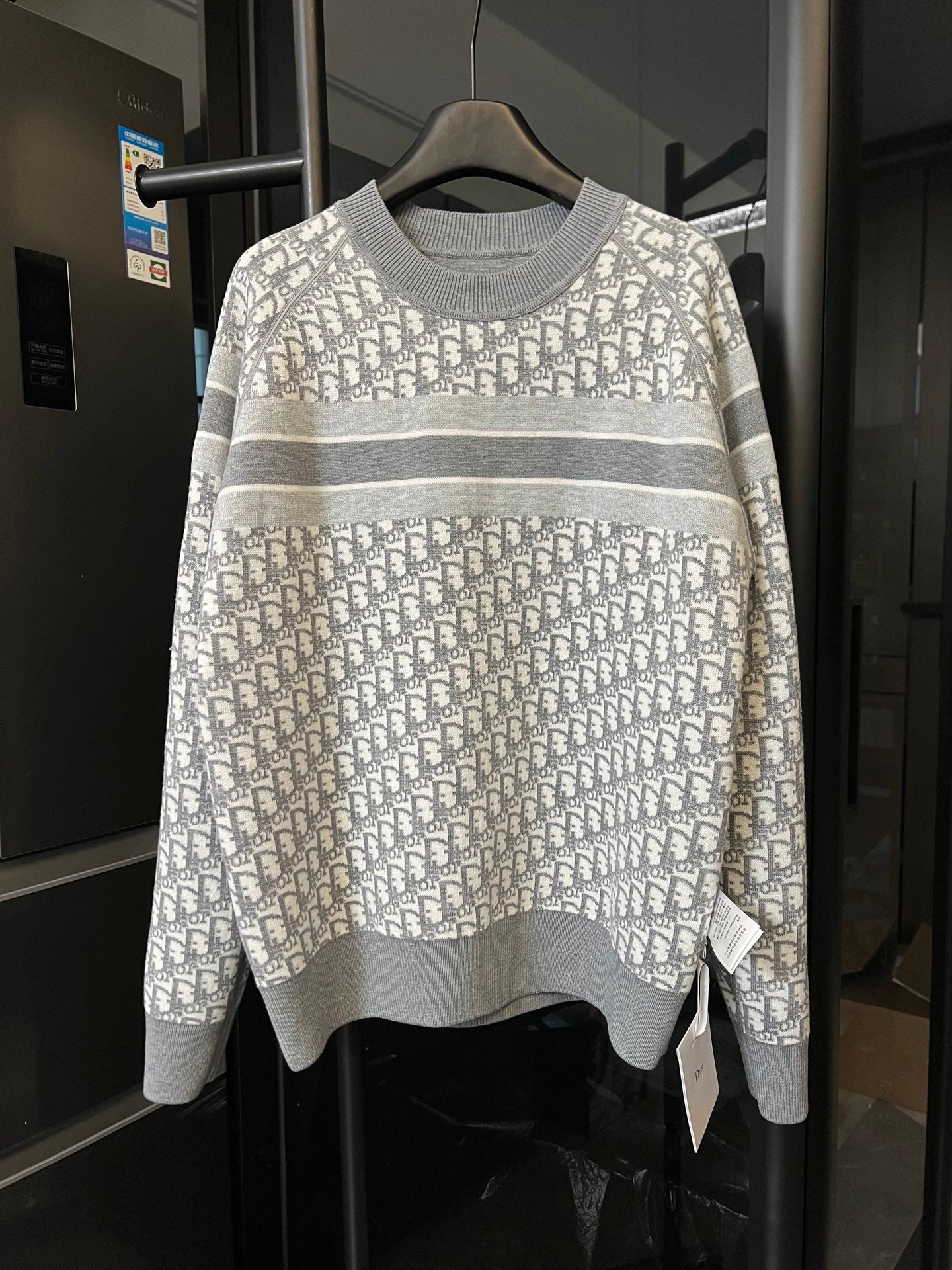 Light gray knit sweater with allover Dior monogram and wide horizontal gray stripe