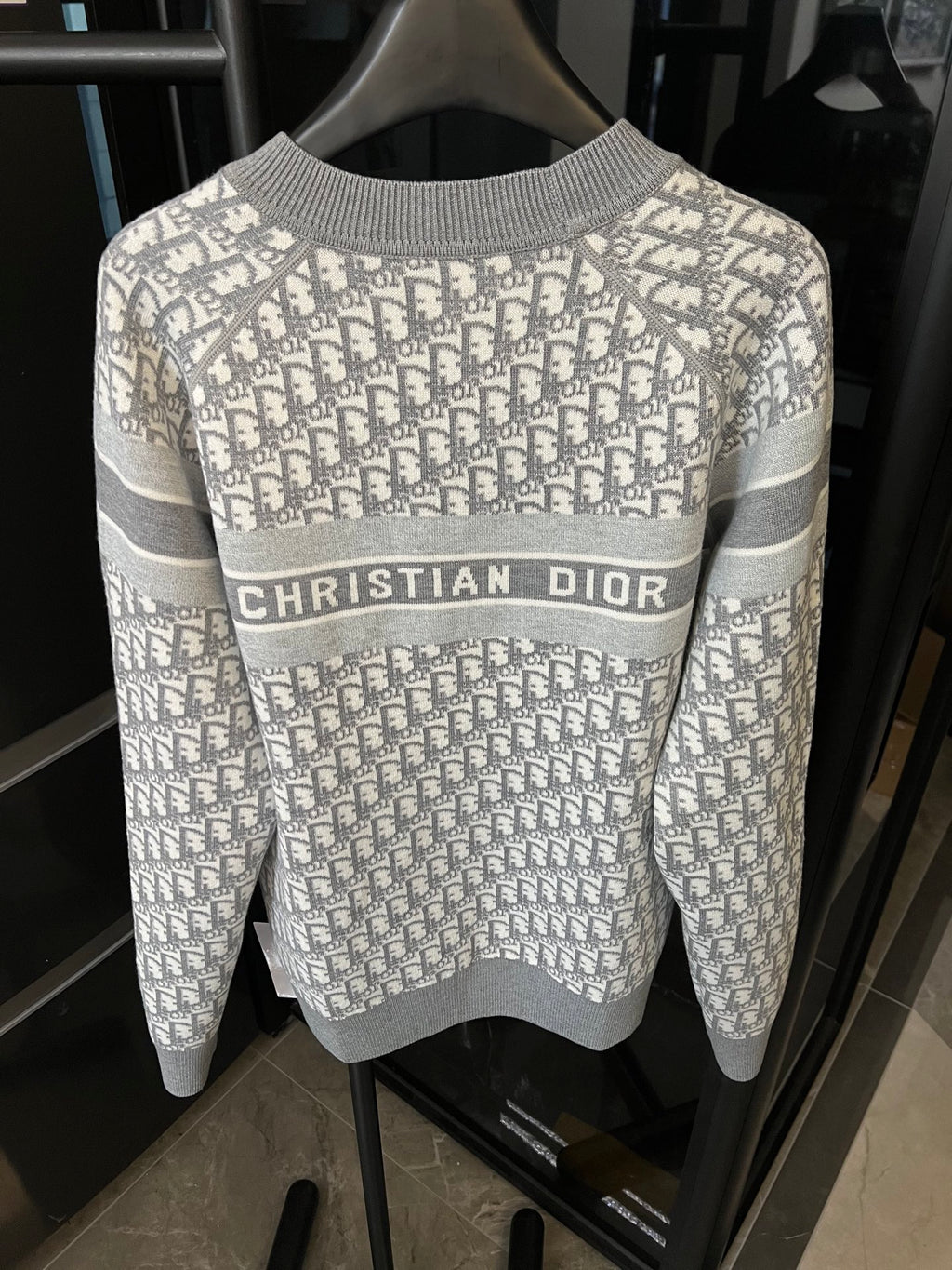 Light gray Dior monogram knit sweater with “CHRISTIAN DIOR” stripe across front