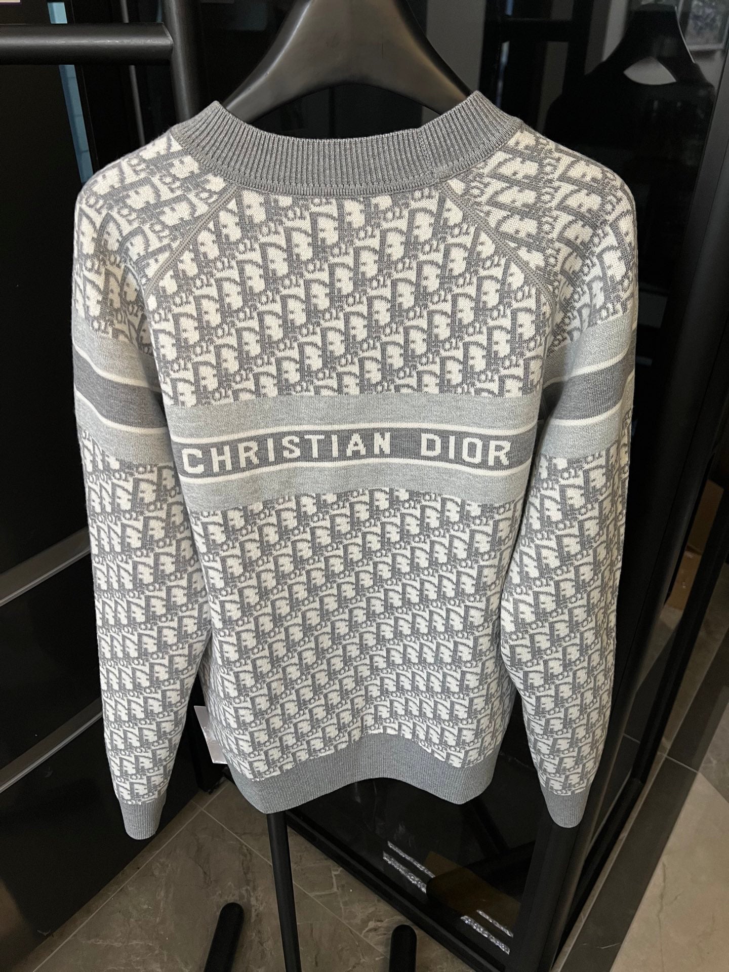 Light gray Dior monogram knit sweater with “CHRISTIAN DIOR” stripe across front