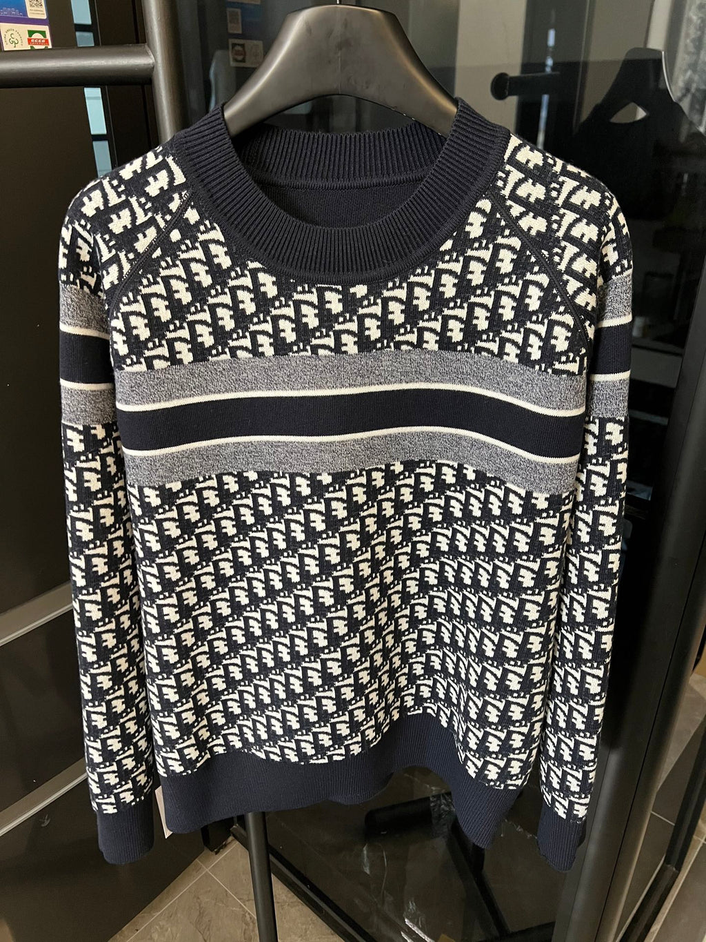 Long-sleeve knit sweater with white logo monogram print, navy cuffs and hem stripe