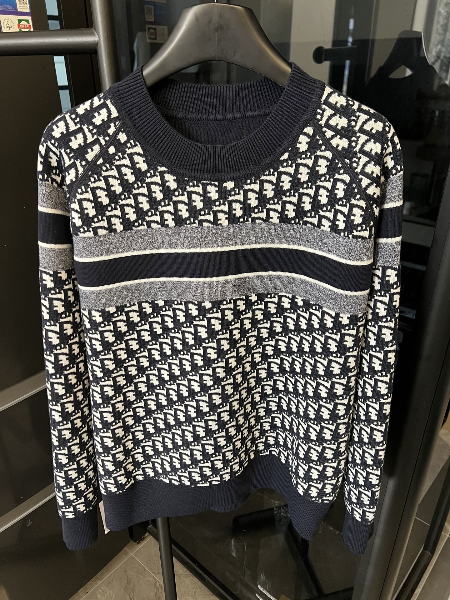 Long-sleeve knit sweater with white logo monogram print, navy cuffs and hem stripe