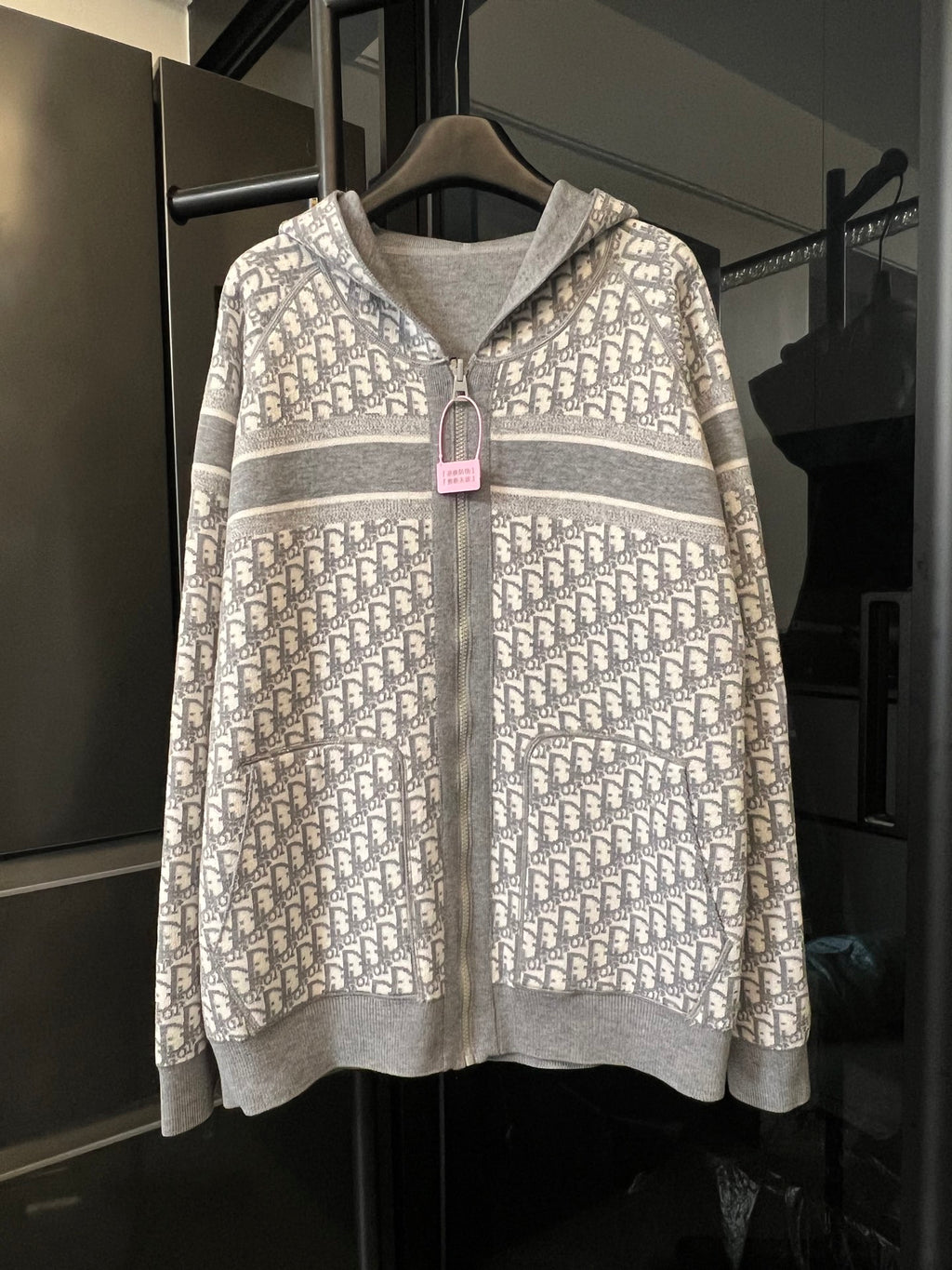 Zip-up hoodie with full Dior monogram pattern, hood, and front zipper