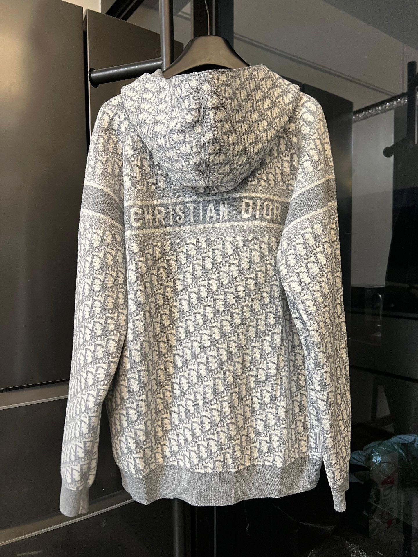 Zip-up hoodie back view with “CHRISTIAN DIOR” logo on Dior monogram print