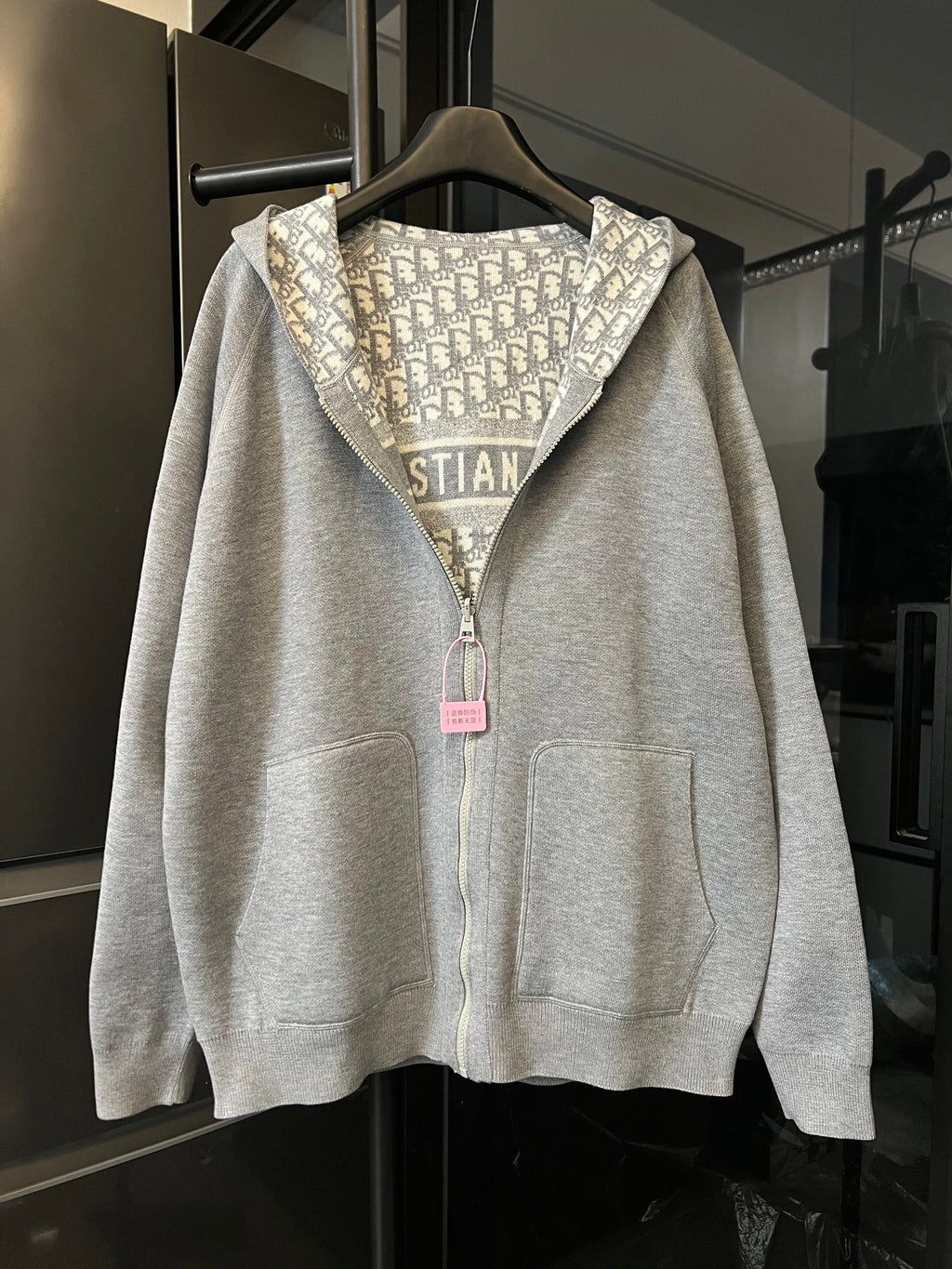 Zip-up hoodie with hood, light gray base, and Dior monogram panel detail