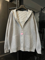 Zip-up hoodie with hood, light gray base, and Dior monogram panel detail