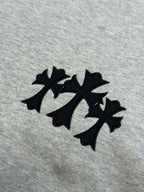 Light gray sweatshirt fabric with three-leaf black logo patch