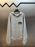 Light gray hooded sweatshirt with black cross logo on chest and front pocket