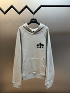 Light gray hooded sweatshirt with black cross logo on chest and front pocket
