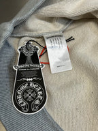 Light gray hooded sweatshirt fabric with brand neck tag and care label