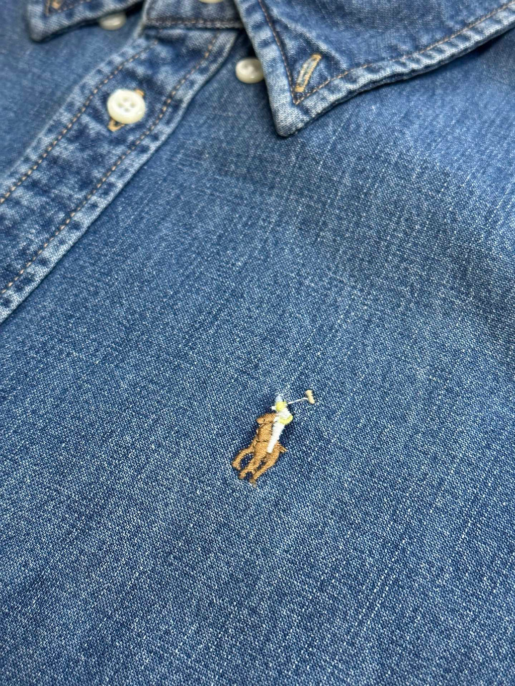 Ralph Lauren blue denim shirt front with white buttons and small embroidered logo