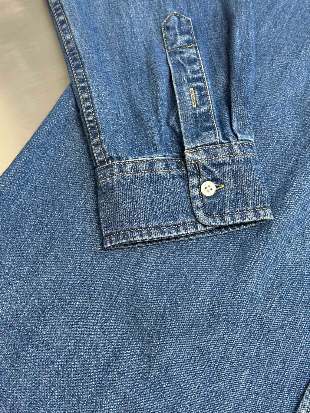 Ralph Lauren blue denim shirt sleeve and cuff with button placket detail