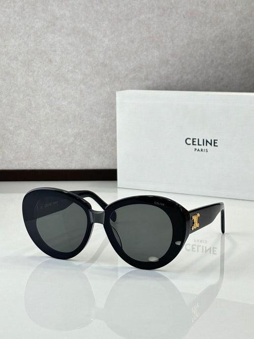 Celine round sunglasses with dark lenses and black frames, gold logo on temples
