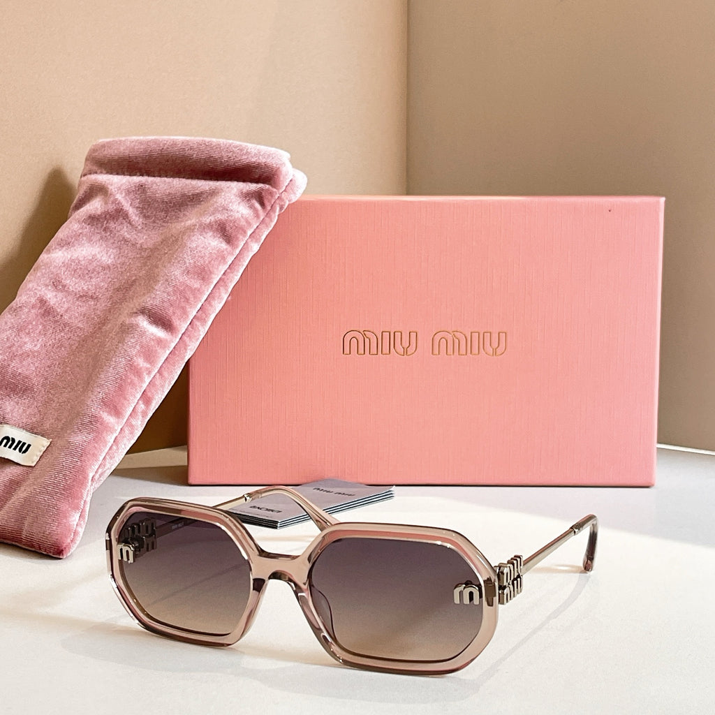 MiuMiu sunglasses with tortoiseshell oversized frames, dark lenses, and gold logo detailing