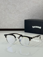 Black and gold full-rim metal eyeglasses with clear lenses, front view