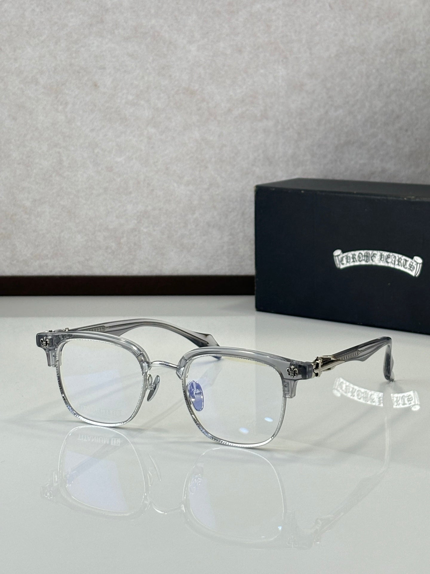 Silver full-rim metal eyeglasses with clear lenses, front view