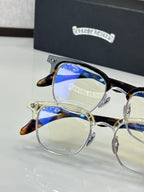 Tortoise and gold full-rim eyeglasses with clear lenses, close-up