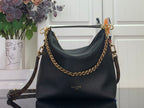 Black leather shoulder bag with gold chain strap and top handles