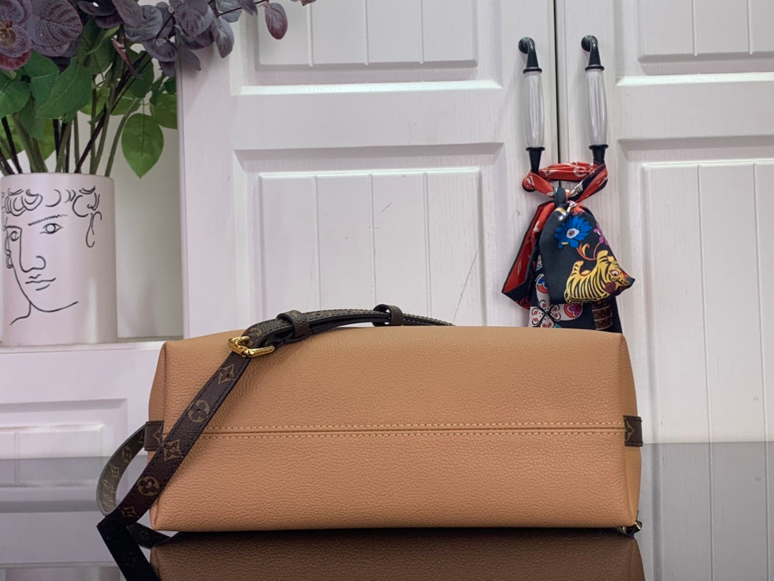 Louis Vuitton flap shoulder bag in tan leather with monogram strap and gold-tone hardware.