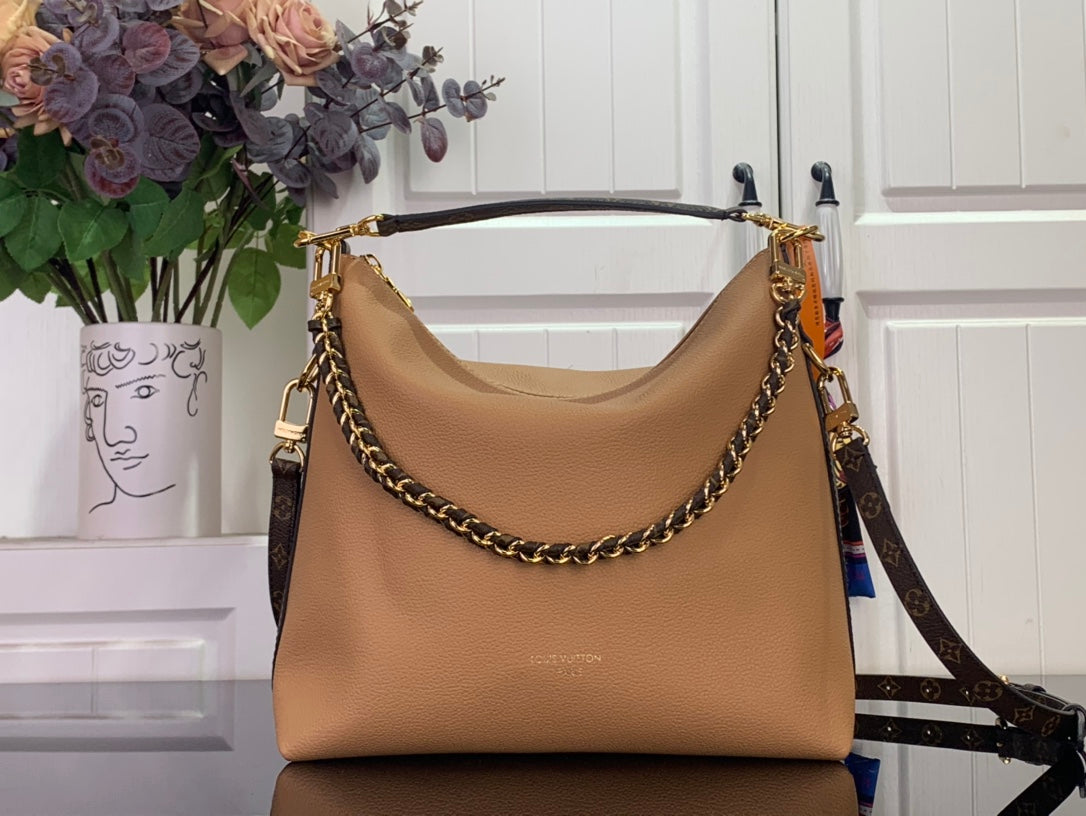Louis Vuitton hobo shoulder bag in tan leather with gold-tone chain strap and top handle.