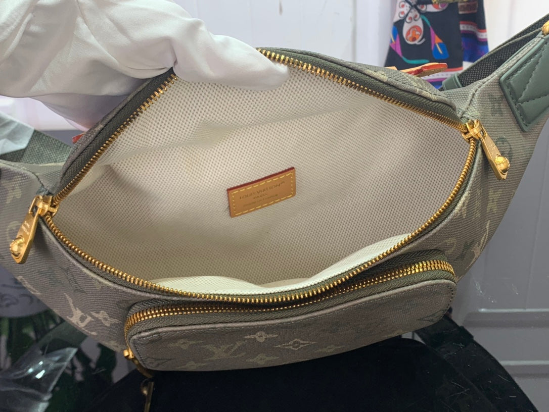 Louis Vuitton belt bag interior with tan lining and gold zipper closure