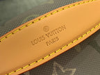 Louis Vuitton belt bag handle label in tan leather with engraved brand text