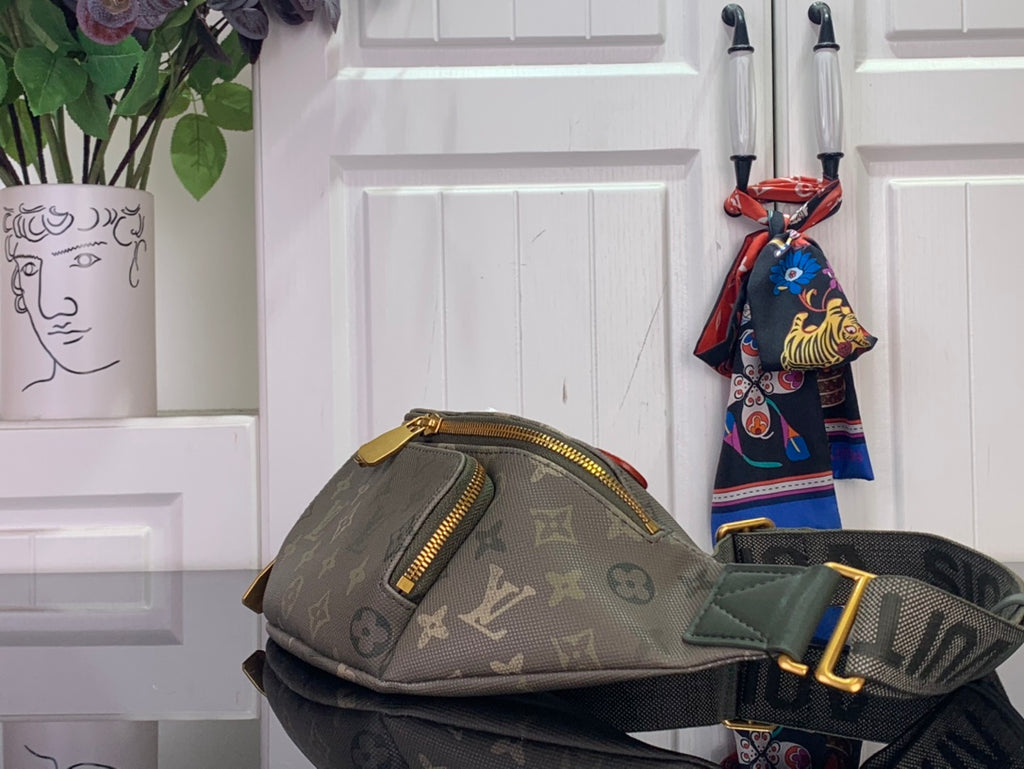 Louis Vuitton monogram sling bag with top zip and golden zipper pulls