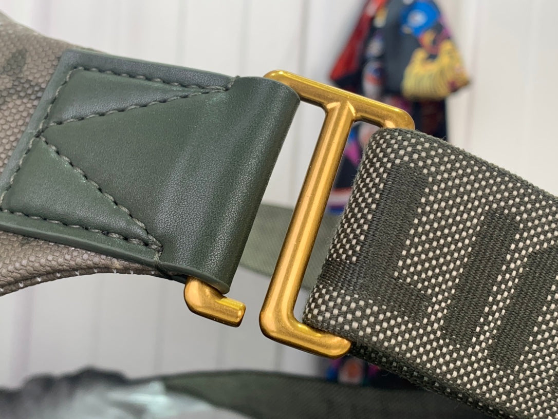 Louis Vuitton strap end with gold buckle and green leather trim