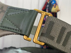 Louis Vuitton belt bag strap close-up with gold O-ring and green leather trim