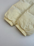 Cream puffer sleeves with gathered elastic cuffs
