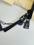 Louis Vuitton logo clip and black strap on long clothing piece