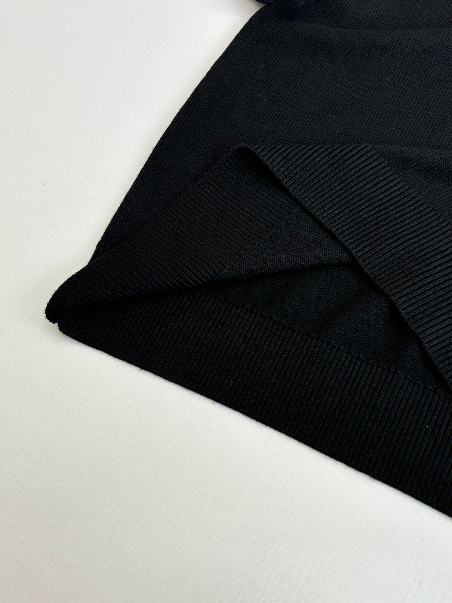 Black Versace crewneck sweater ribbed hem and knit texture