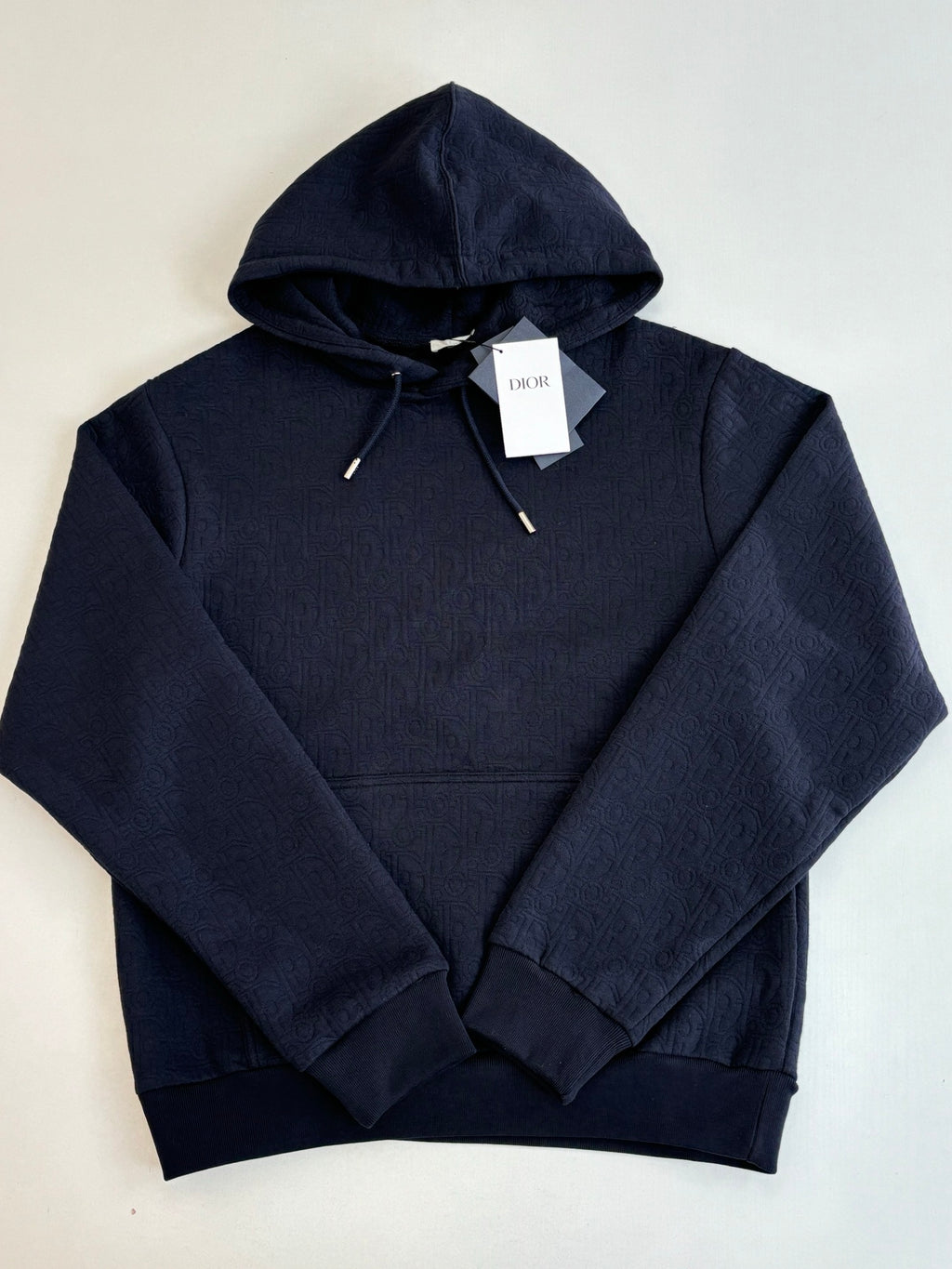 Dior navy pullover hoodie close-up, drawstrings and kangaroo pocket