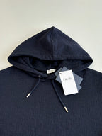 Dior navy pullover hoodie close-up, drawstring hood and front pouch pocket