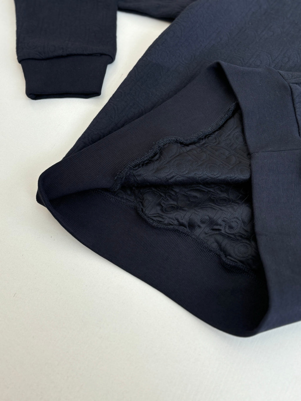 Dior navy long pants fabric detail, embossed monogram texture