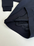 Dior navy long pants fabric detail, embossed monogram texture
