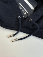 Dior navy hoodie close-up, round drawcord tips and interior label