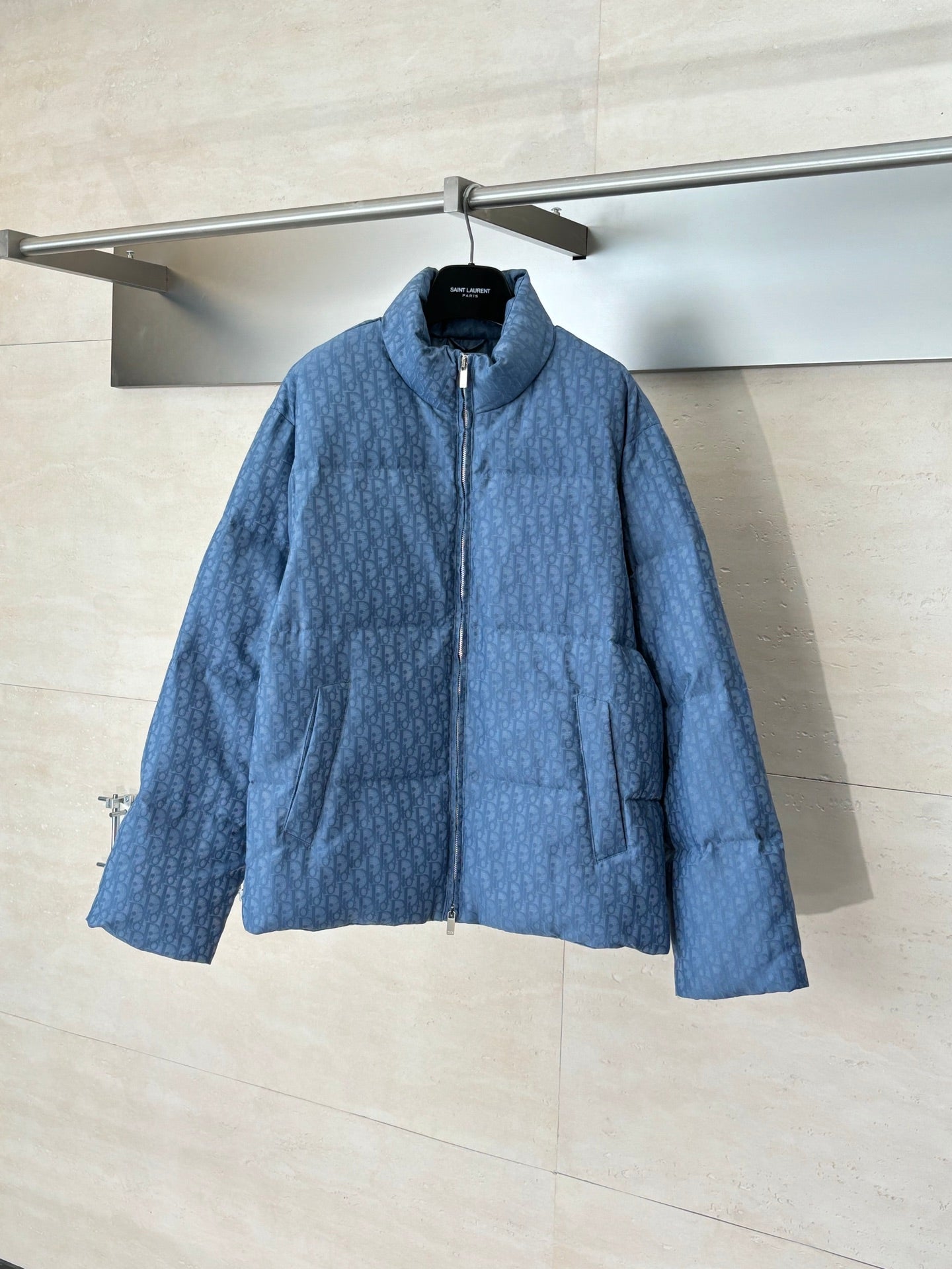 Blue Dior hooded puffer jacket with full front zip and quilted texture