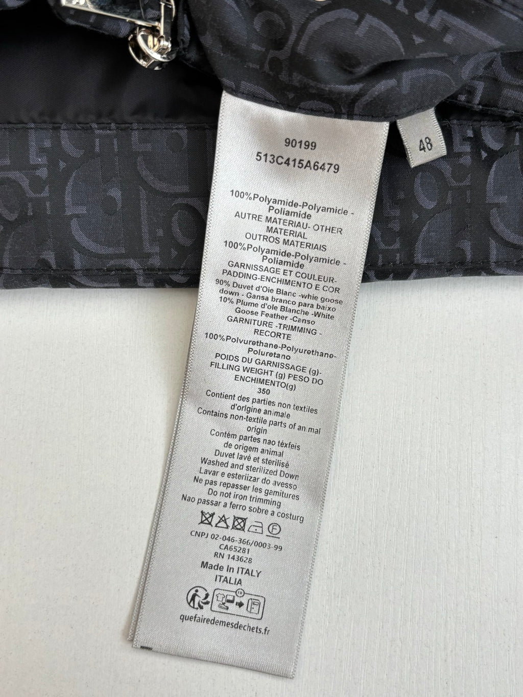Dior long garment care label on dark inner lining