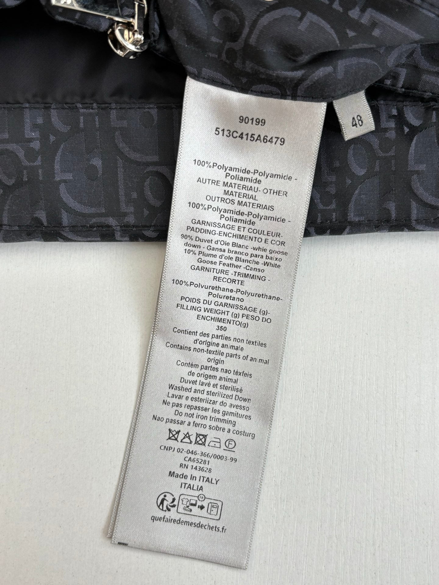 Dior long garment care label on dark inner lining